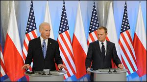 U.S. Vice President Joe Biden, left, speaks to the press after talks with Polish Prime Minister Donald Tusk, right, in Warsaw, Poland, today.