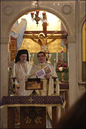 The Rev. Aristotle Damaskos, right, is joined by Metropolitan Nicholas of Detroit at the Divine Liturgy at Holy Trinity Greek Orthodox Cathedral.