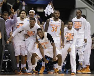 Tennessee players celebrate near the end of their third-round win against Mercer Sunday, in Raleigh. Tennessee Won 83-63.