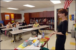 Blade food editor Mary Bilyeu talks with the seventh Grade Reading Club at Raymer School.