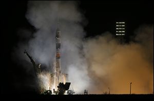 The Soyuz-FG rocket booster with Soyuz TMA-12M space ship carrying a new crew to the International Space Station blasts off at the Russian leased Baikonur cosmodrome, Kazakhstan, today. The Russian rocket carries astronaut Steven Swanson, Russian cosmonauts Alexander Skvortsov and Oleg Artemyev.