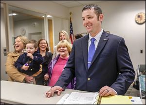 Matt Cherry, with his family in tow, files petitions to run for the Toledo City Council District 2 seat at the Lucas County Board of Elections. The seat was vacated by D. Michael Collins, who  is now mayor.