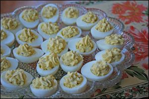 Divine Deviled Eggs with Fresh Rosemary have delicious flavor, and thanks to light mayonnaise, have fewer calories than traditional deviled eggs.