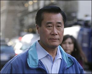 California Sen. Leland Yee, D-San Francisco leaves the San Francisco Federal Building, Wednesday. The FBI has filed a 137-page affidavit outlining a detailed corruption case against Yee, who is accused of asking for campaign donations in exchange for introducing an undercover agent to an arms trafficker.