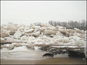 An ice shove about 15 feet high, above, buried the lower tow path at Side Cut Metropark along the Maumee River in late February.