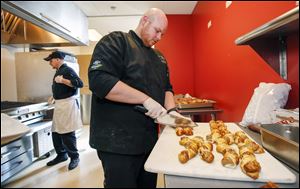 Chef Dusten Brown of the Mud Hens prepares Pretzel Super Twists for a food tasting event at Fifth Third Field.