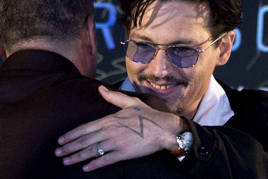 Engaged Johnny Depp shows off 'chick's ring' - The Blade