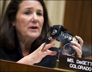 Rep. Diana DeGette (D., Colo.), ranking member of the House Oversight and Investigations subcommittee, holds up a GM ignition switch while she questions General Motors CEO Mary Barra on Capitol Hill on Tuesday.