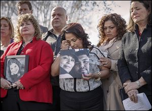 Rosie Cortinas, center, holds a photo of her son, Amador Cortinas of Homedale, Idaho, who was killed driving a Chevy Cobalt. She joined other grieving families on Capitol Hill with U.S. Rep. Diana DeGette (D., Colo.), right.