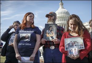 Mary Ruddy, right, of Carbondale, Pa., whose daughter Kelly, 21, was killed in 2010 while driving a 2005 Cobalt, and other relatives of people who were killed while driving the Chevrolet car  gather on Capitol Hill in Washington this week.