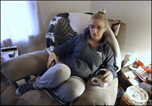 Julie Mason recalls hearing the shot that hit a black-and-tan female German shepherd. The dog had a leg amputated but is recovering in a Planned Pethood foster home and is expected to be adopted.