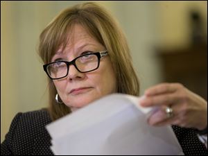 General Motors CEO Mary Barra listens as she is grilled during a hearing on Capitol Hill Wednesday.