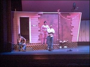 Cast members, from left, Christopher Smith, Amber Breault-Albain, and Jeremy Wilkes rehearse a scene from ‘Great American Trailer Park Musical.’ The cast will perform Friday, Saturday, and Sunday.