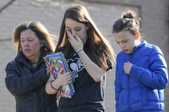 A-parent-escorts-distraught-students-from-the-Franklin-Regi