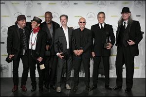 Hall of Fame Inductees, E Street Band, from left to right, Steven Van Zandt, Nils Lofgren, David Sancious, Garry Tallent, Roy Bittan, Max Weinberg, and Vini Lopez appear in the press room.