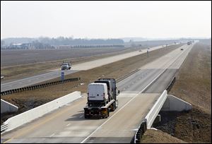 The new U.S. 24, shown stretching east near Texas, Ohio, has cut down on truck traffic in small communities along the old route.