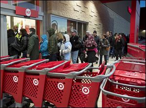 Shoppers enter a Target store in Dartmouth, N.S., on Black Friday last year. Since its incursion into Canada in 2013, Target’s troubles have included difficulties keeping the shelves stocked and weak sales, resulting in nearly a $1 billion loss for the year.