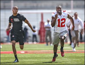 Ohio State senior Malcom Bransen competes against the Buckeyes’ Doran Grant in a 40-yard dash. Grant won against the student.