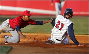 Toledo’s Mike Hessman steals second base as Columbus’ Jose Ramirez is late with the tag in the second inning at Fifth Third Field. It was the 38th steal in Hessman’s 17-year pro career.