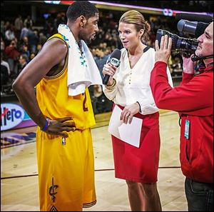 Allie Clifton of Fox Sports Ohio interviews Kyrie Irving of the Cleveland Cavaliers. Clifton, a former UT basketball player, decided late in college to pursue TV work instead of teaching.