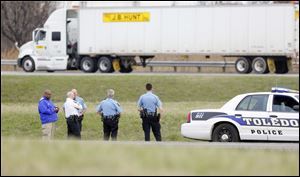 Authorities respond to an unidentified and suspicious looking object located on I-75 southbound near Alexis Road today.