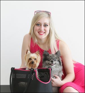 Tader Shipley, who plays lead character Elle Woods in Bowling Green State University’s production of ‘Legally Blonde,’ with Nugget, who plays Elle’s dog Bruiser, and Kit, who plays Rufus, Elle’s friend Pauline’s dog.
