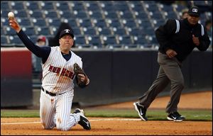 Toledo Mud Hens third baseman Mike Hessman makes a play against the  Indianapolis Indians during the fourth inning.