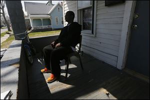 A former member of the Manor Boyz sits on the porch of a family member’s home and talks about the past year of his life. But not everyone has left the streets.