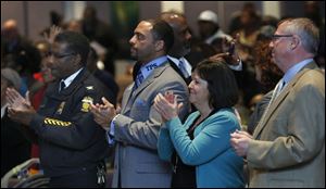 From left: Toledo Police chief William Moton, TPS superintendent Dr. Romules Durant, Tina Skeldon-Wozniak and Mayor Michael Collins attend the Toledoans United for Social Action's 2014 Nehemiah action meeting at Friendship Baptist Church in Toledo.