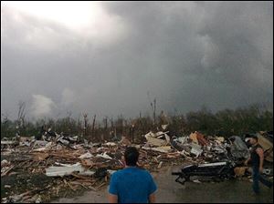 Tornado damage, Sunday in Mayflower, Ark. A powerful storm system rumbled through the central and southern United States on Sunday, spawning several tornadoes, including one that killed two people in a small northeastern Oklahoma city.