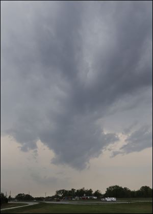 Storm clouds move over I-49 near Nevada, Mo., Sunday.