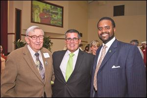 Andy Devine, Dan Rogers, CEO of Cherry Street Mission, and John Jones, board member at the fund-raiser.