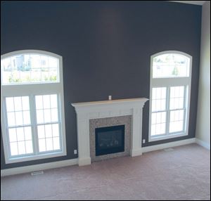 A beautiful fireplace is a focal point of the great room.