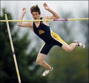 Austin Hanna of Whitmer clears the bar in the pole vault at St. Francis. He won the event to help lead the Panthers to the title.