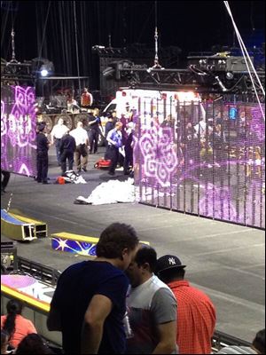 Emergency workers tend to injured performers after a platform collapsed during the Ringling Brothers and Barnum and Bailey Circus' Legends show at the Dunkin' Donuts Center in Providence, R.I.