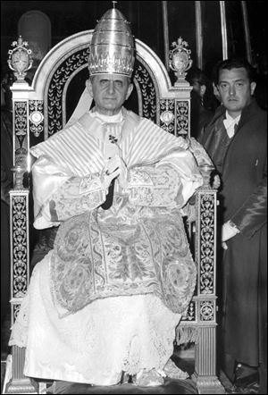 Pope Paul VI sits on his throne outside St. Peter's Basilica during ceremonies marking his 1963 coronation.