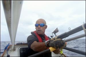 Victor Mooney rows the Spirit of Malabo in the Atlantic Ocean.  