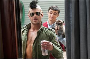 Zac Efron, left, and Dave Franco in a scene from the film, 