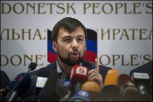 Insurgent leader Denis Pushilin speaks during a news conference in Donetsk, Ukraine, today. The referendum balloting Sunday in the Donetsk and Luhansk regions, which together have 6.5 million people, was condemned as a sham and a violation of international law by Kievs interim government and other western powers.