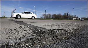 The pitted and patched 6 inches of concrete on Isaac Streets Drive in Oregon will be replaced with a fresh 8 inches of paving. The project will cost $868,952, the city’s biggest single-road contract this year.
