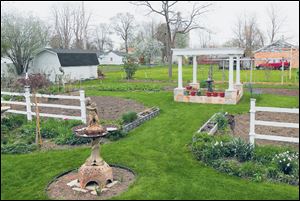 The backyard garden is divided into four quadrants.