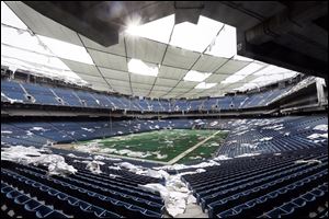 Nowadays the Pontiac Silverdome, a 80,000-seat indoor stadium, is a shell of its former self with its roof in tatters and a lack of electrical power that has left the stadiums innards dark and mold-covered. 