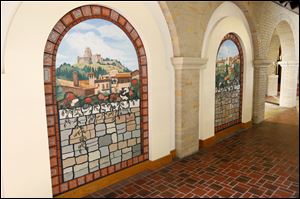 Sister Jane Mary Sorosiak created these two ceramic tile and acrylic murals for Lourdes University. The two arched murals depict views of Assisi, where St. Francis founded three orders.