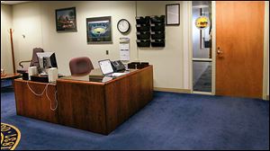 The receptionist’s desk is un-attended Friday outside the mayor’s office at One Government Center.
