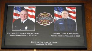 Station 7 personnel were some of the first on the scene of the blaze that killed Stephen Machcinski and James Dickman. These photos hang over the kitchen doorway.
