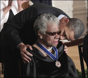 President Obama kisses author and poet Maya Angelou after awarding her the 2010 Medal of Freedom during a ceremony at the White House in Washington in February, 2011.