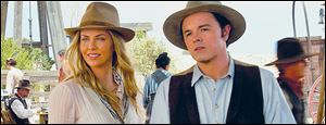 Charlize Theron and Seth MacFarlane in a scene from ‘A Million Ways to Die in the West.’