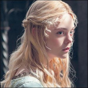 Elle Fanning portrays Aurora in Disney’s ‘Maleficent.’