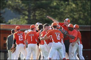 The Sylvania Southview Cougars celebrate their victory over the Anthony Wayne Generals at the pitchers mound directly after the end of the game. 
