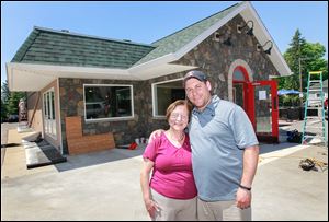Maddalena Zanger and her son Stefano Zanger, outside of Lena’s Italian Restaurant, used some of their first grant award  to resurface the front of their restaurant in fieldstone and construct a vestibule.